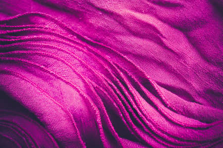 Pink wrinkled cloth texture backgroundの写真素材