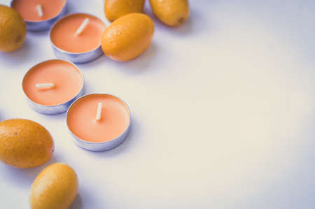 Orange aroma candles on grey backgroundの写真素材