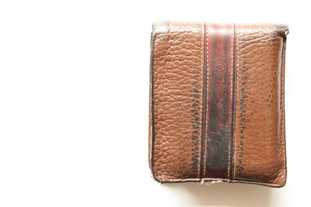 Old brown leather wallet isolated on white backgroundの写真素材