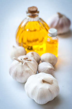 Garlic oil in bottles isolated on white background