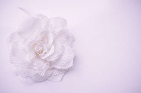 Artificial white flower on grey backgroundの写真素材