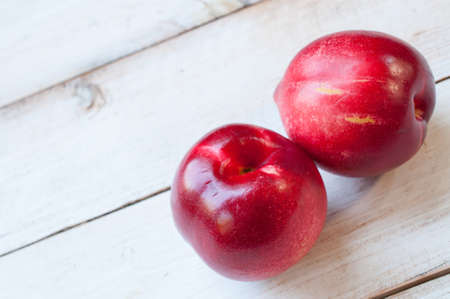 two nectarine on wooden backgroundの写真素材
