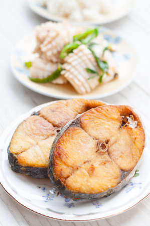 stir-fried squid and basil and Deep fried King Mackerel fishの写真素材
