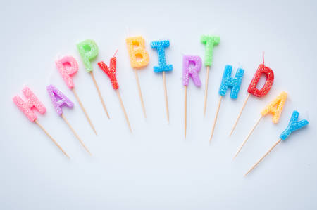 Colorful happy birthday candlesの写真素材