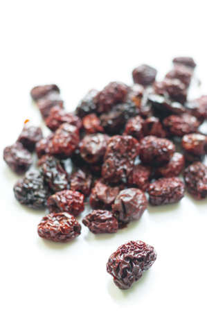 Dry red jujube isolated on white backgroundの写真素材