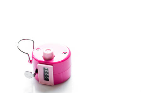 Hand tally counter isolated on white backgroundの写真素材