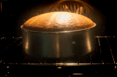 Baking cake in ovenの写真素材