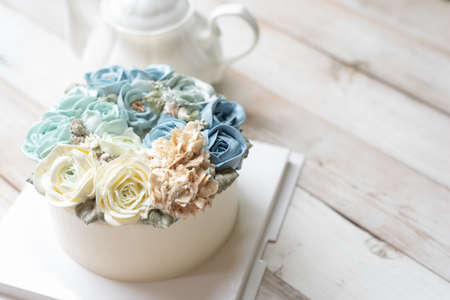 Blue buttercream flowers cakeの写真素材