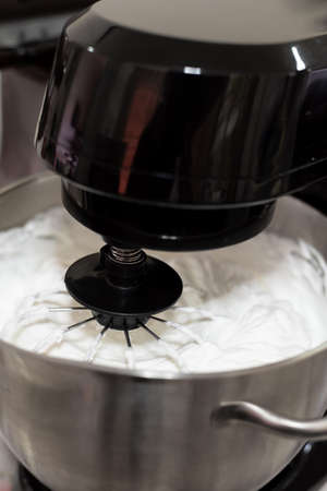 Making italian  meringue with electric mixerの写真素材