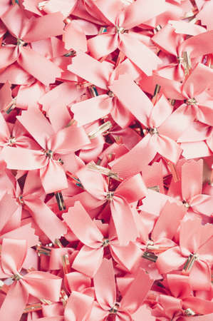 Pink ribbon pastel bows backgroundの写真素材