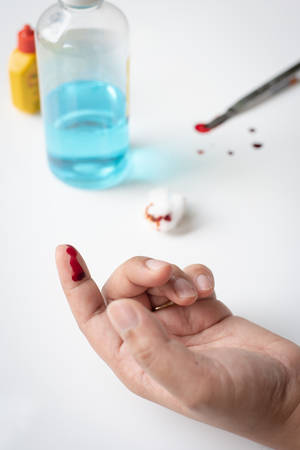 Bllod on finger, injury from cutterの写真素材