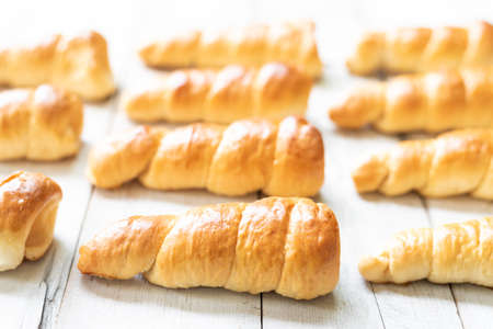 Baking horn bread  on wooden backgroundの写真素材