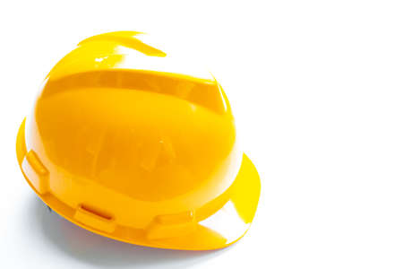 Yellow safety helmet isolated on white backgroundの写真素材