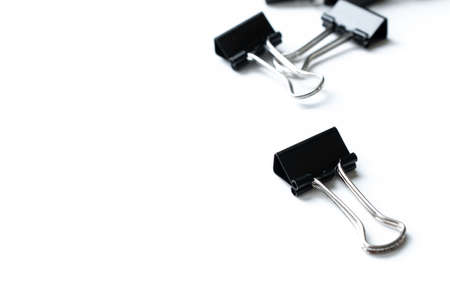 Black paper clip isolated on white backgroundの写真素材
