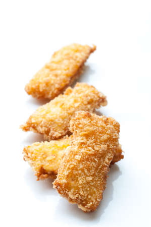 Fried fish nuggets on white backgroundの写真素材