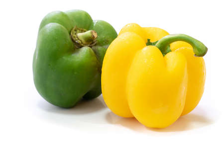 Yellow and Green sweet bell pepper or capsicum isolated on white backgroundの写真素材