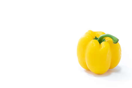 Yellow sweet bell pepper or capsicum isolated on white backgroundの写真素材