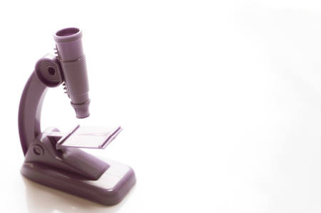 Plastic microscope toy isolated on white backgroundの写真素材