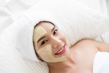 Spa beauty treatment, skincare. Woman getting facial care at spa salonの写真素材