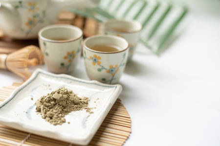 Greentea powder with teacup and teapotの写真素材