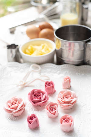 Pink buttercream flower with ingredients, for decorated cakeの写真素材