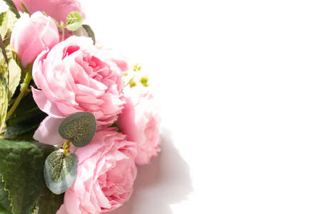 Pink artificial flower isolated on white backgroundの写真素材