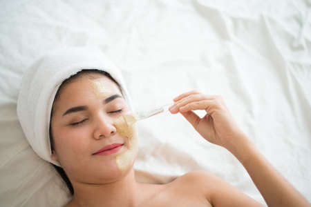 Spa beauty treatment, skincare. Woman getting facial care at spa salonの写真素材