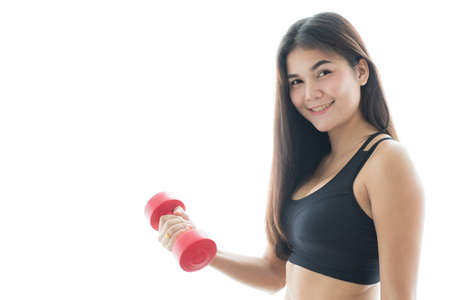 Woman in sportswear lifting dumbell isolated on white backgroundの写真素材