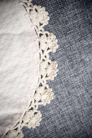 Grey linen and white lace background