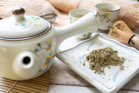 Greentea powder with teacup and teapotの写真素材