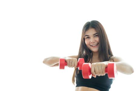 Woman in sportswear lifting dumbell isolated on white backgroundの写真素材