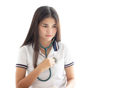 Doctor using stethoscope to checking herselfの写真素材