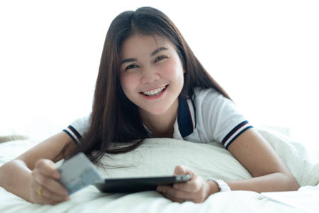 Woman using credit card to shopping online by internet bankingの写真素材