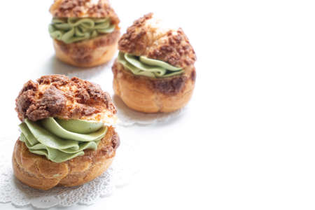 Craquelin Choux Buns with chocolate and matcha tea creamの写真素材