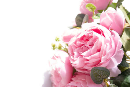 Pink artificial flower isolated on whiteの写真素材
