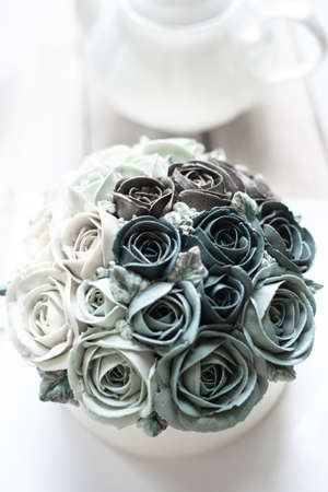 Buttercream flower cake with teapotの写真素材