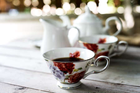 colorful English tea cup on a teal tableの写真素材