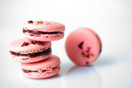 Pink macarons with dry rose petalsの写真素材
