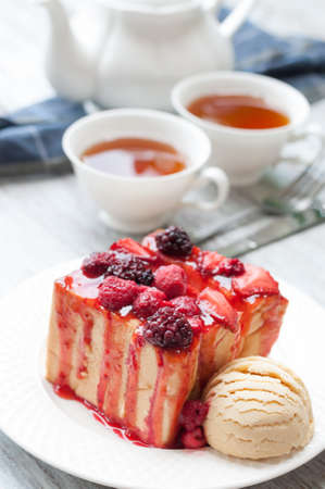 sweet toasts with raspberry, jam and a cup of teaの写真素材