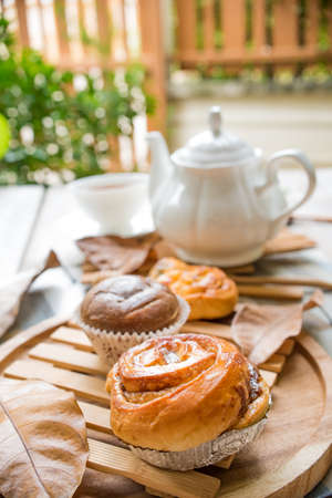 cinnamon rolls with afternoon tea setの写真素材