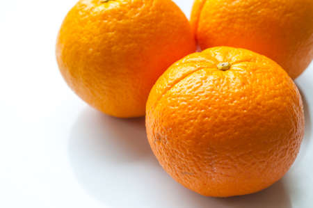 Ripe mandarin orange isolated on white backgroundの写真素材