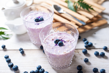 Glass of blueberry smoothie with oatmealの写真素材