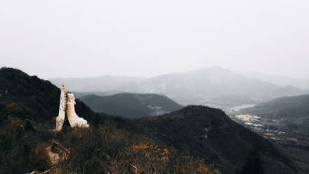 Mountain landscape in the fog. Panorama of the mountain top.の写真素材