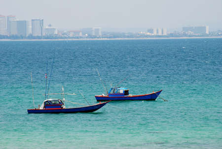 Two boats in blue oceanの写真素材