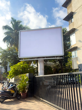 Ooh Billboard mockup outdoors. An empty outdoor at residential places for presentation. hoarding in front of building. Blank commercial mock-up, poster, banner, dummy placementの写真素材