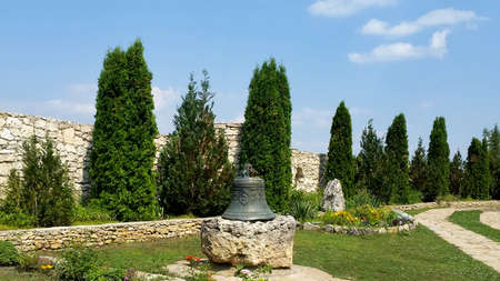 Church bell in garden of Old Orhei monastery on Raut river in Moldova