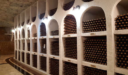 CRICOVA, MOLDOVA July 24, 2017 :Underground wine cellar with collection of bottles in niches. Winery...