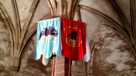 OLD FLAGS IN KNIGHTS ROOM IN HUNYADI CASTLE, HUNEDOARA, ROMANIAのeditorial素材