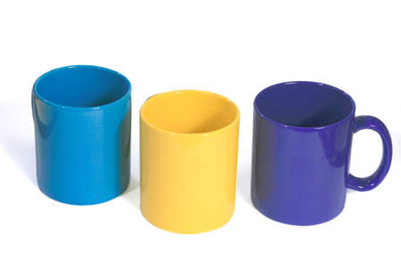 Three multicolored tea cups isolated on a white の写真素材