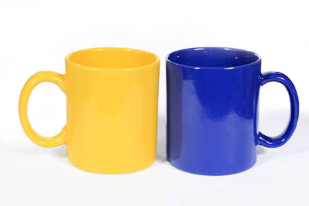 Two multicolored tea cups isolated on a white の写真素材